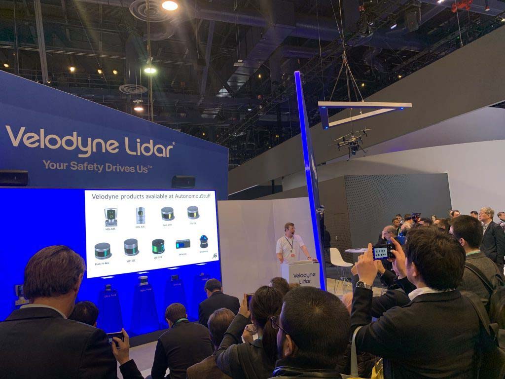 Photograph of Velodyne Lidar display with people watching a presentation